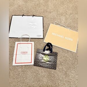 Y2K Coach Michael Kors and Tory Burch shopping gift bags for Christmas presents